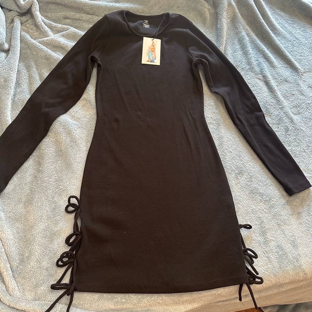 Tik tok famous Little black dress with tie sides at the bottom.